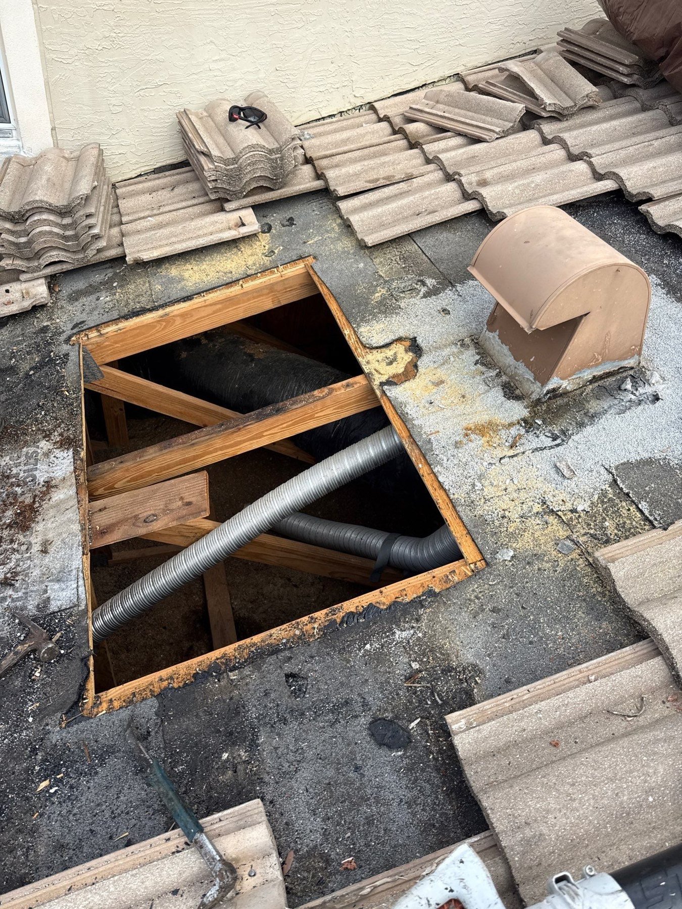 Tile roof repair area opened to the framing in Andros Isle