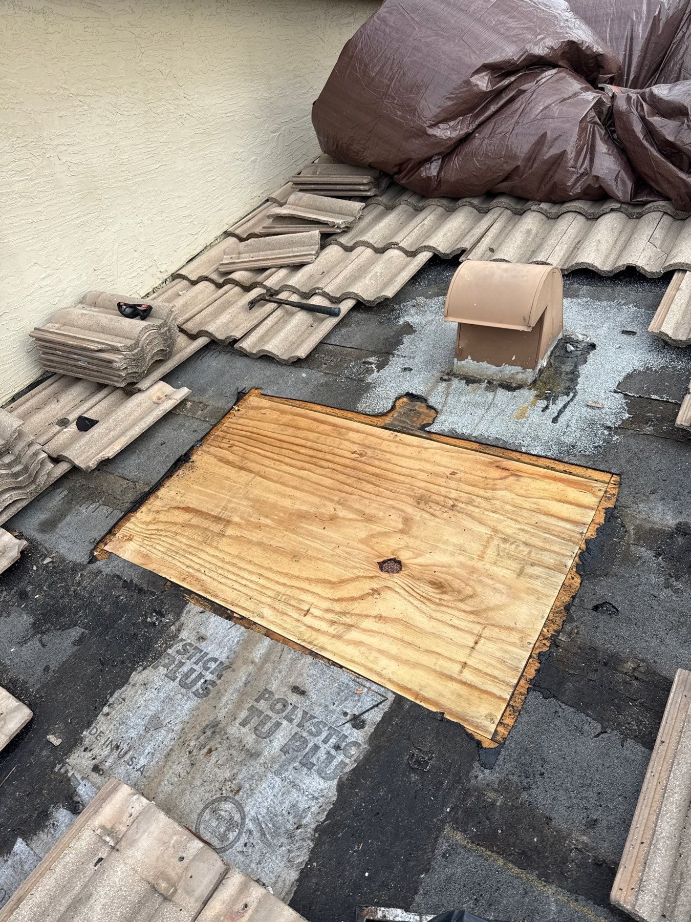 New plywood installed during an Andros Isle tile roof repair