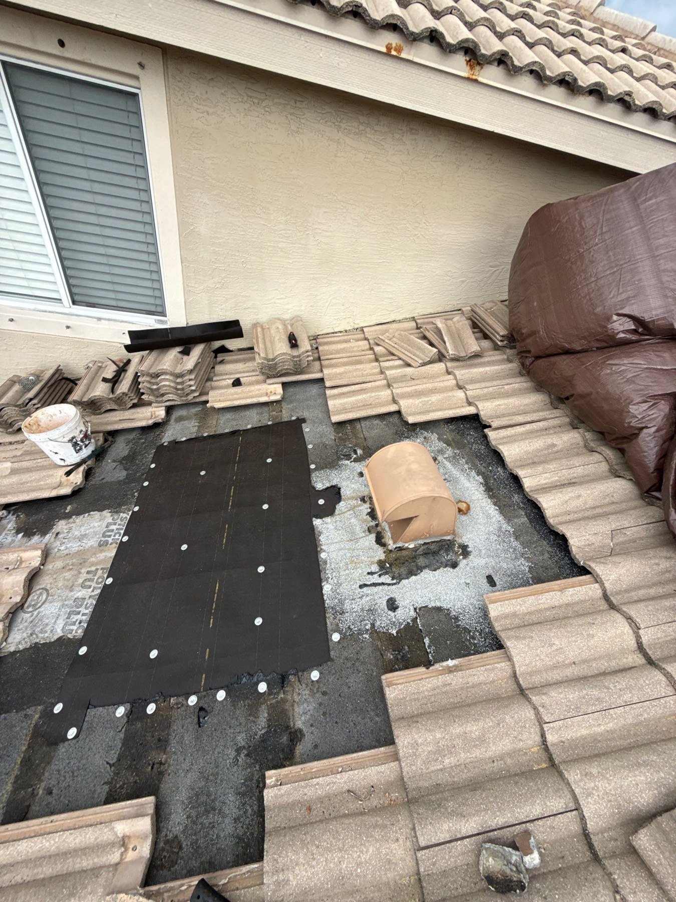Underlayment installed over a repaired roof deck in Andros Isle