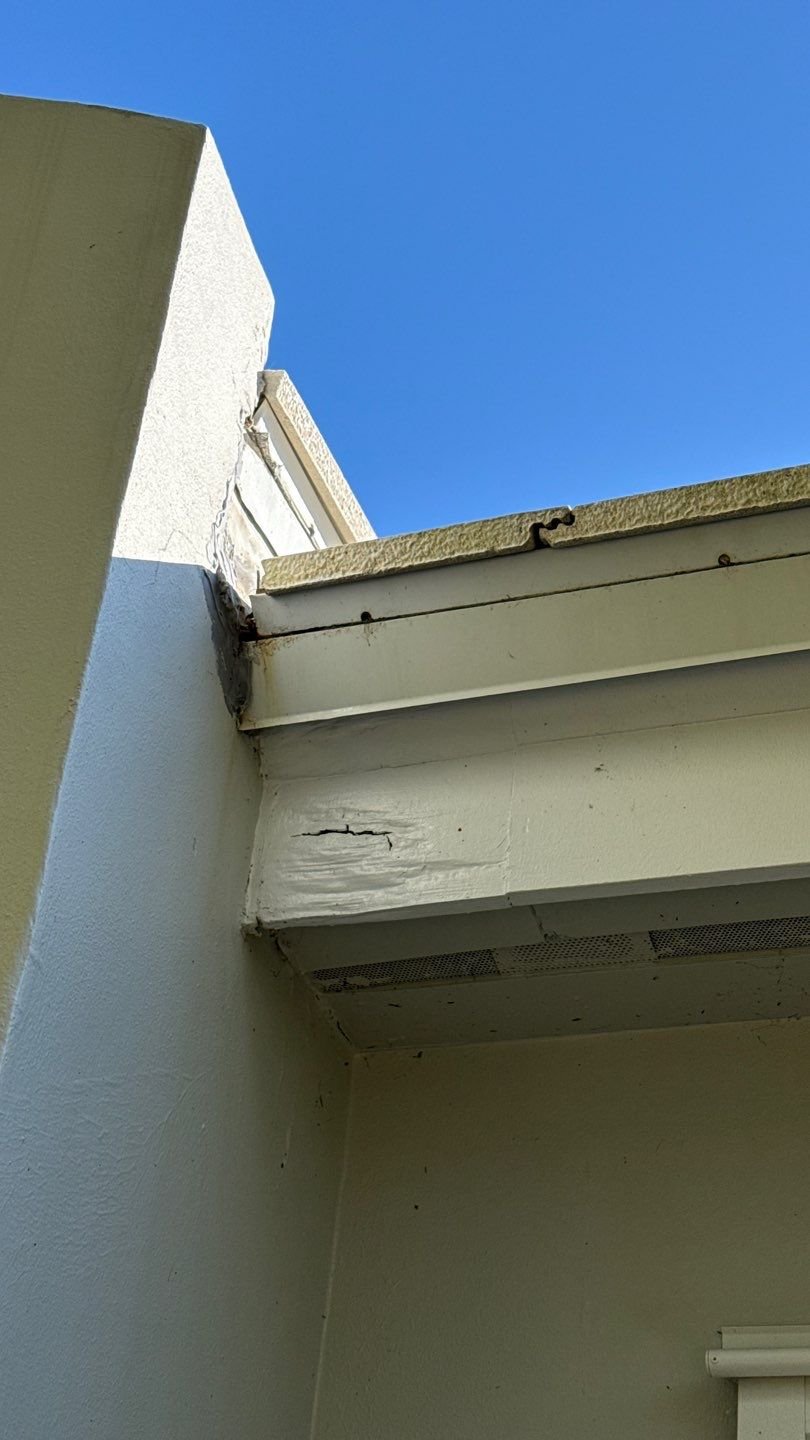 Rotten fascia and roof edge damage from a roof leak