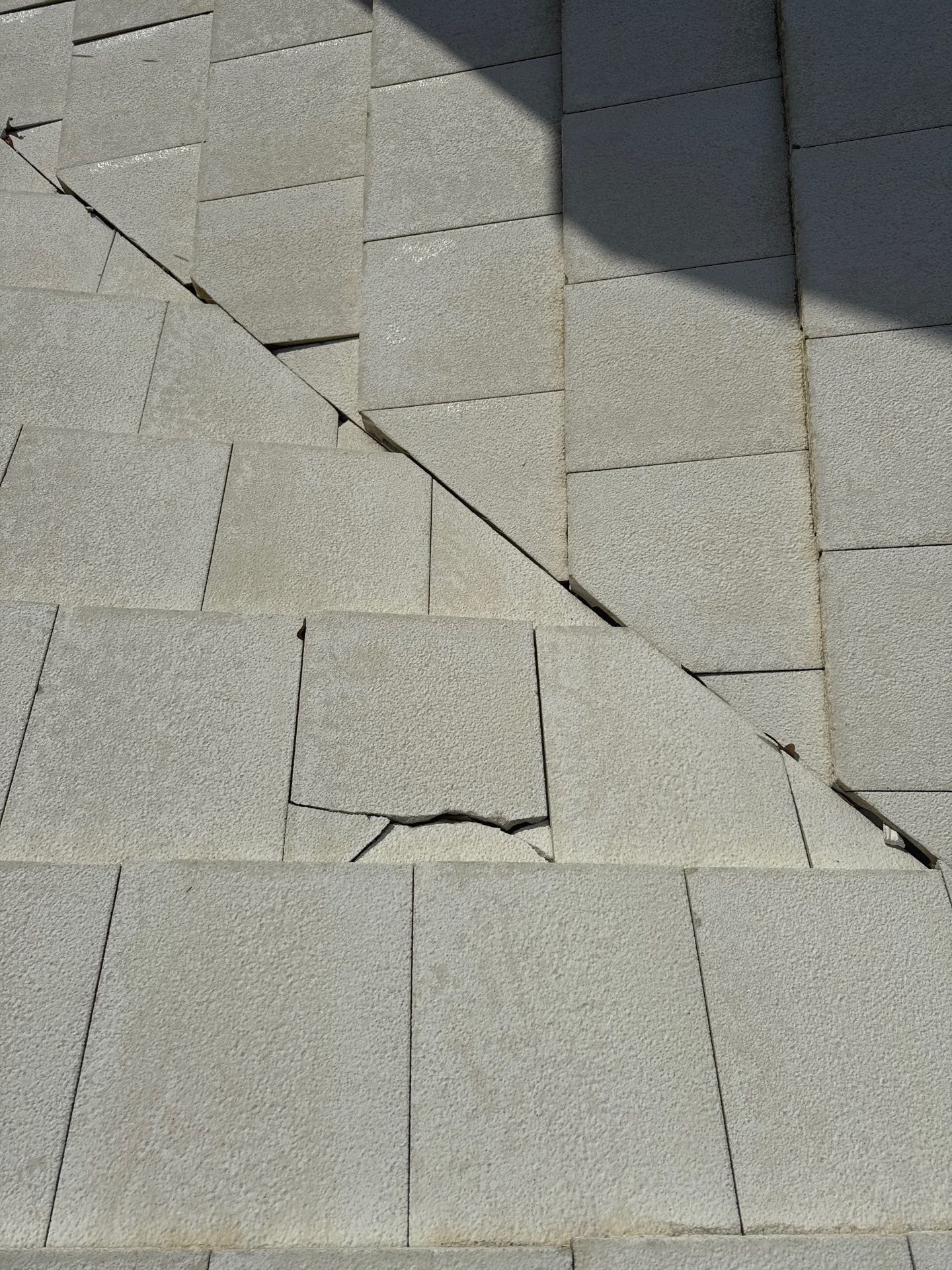 Broken roof tile in a valley where water can reach the underlayment