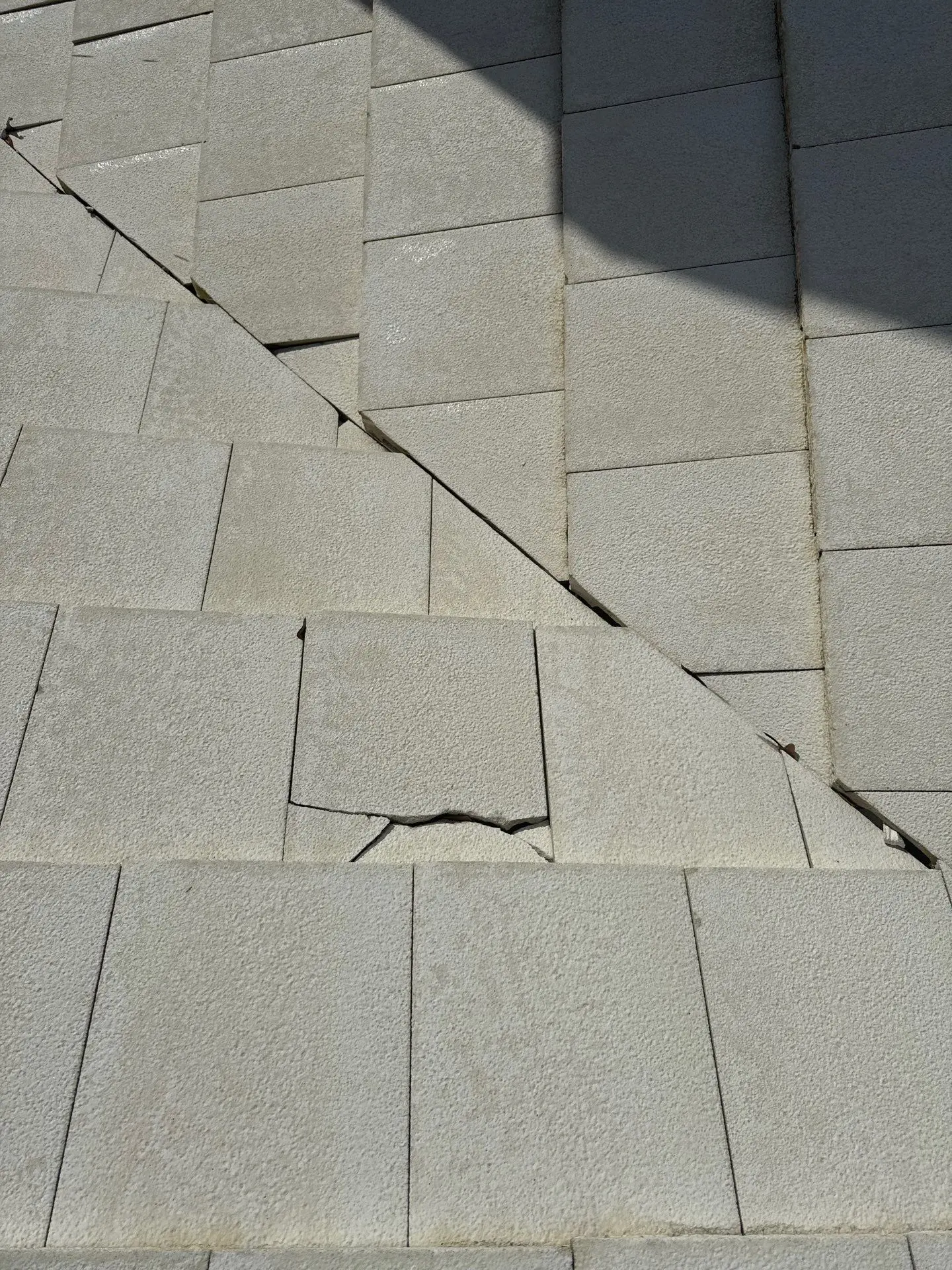 Broken roof tile in a valley where water can reach the underlayment