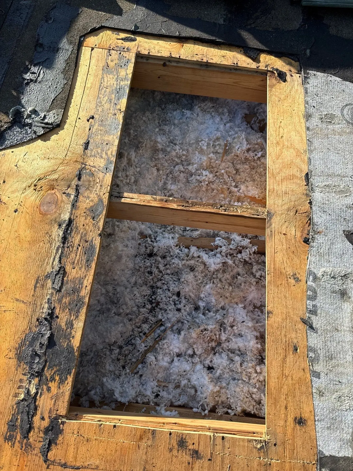 Tile roof repair area opened to inspect the deck in The Isles at Wellington
