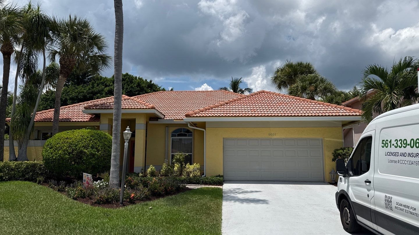Roofs Done Right truck outside a South Florida home with a tile roof