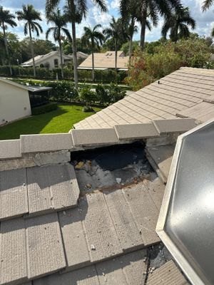 Broken and missing concrete roof tiles before repair in Boynton Beach