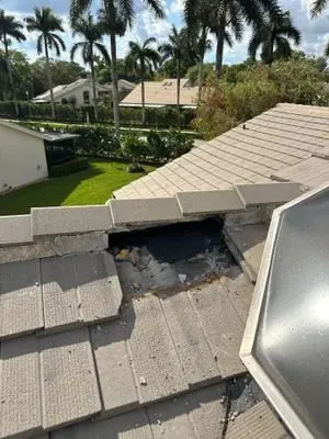 Broken and missing concrete roof tiles before repair in Boynton Beach