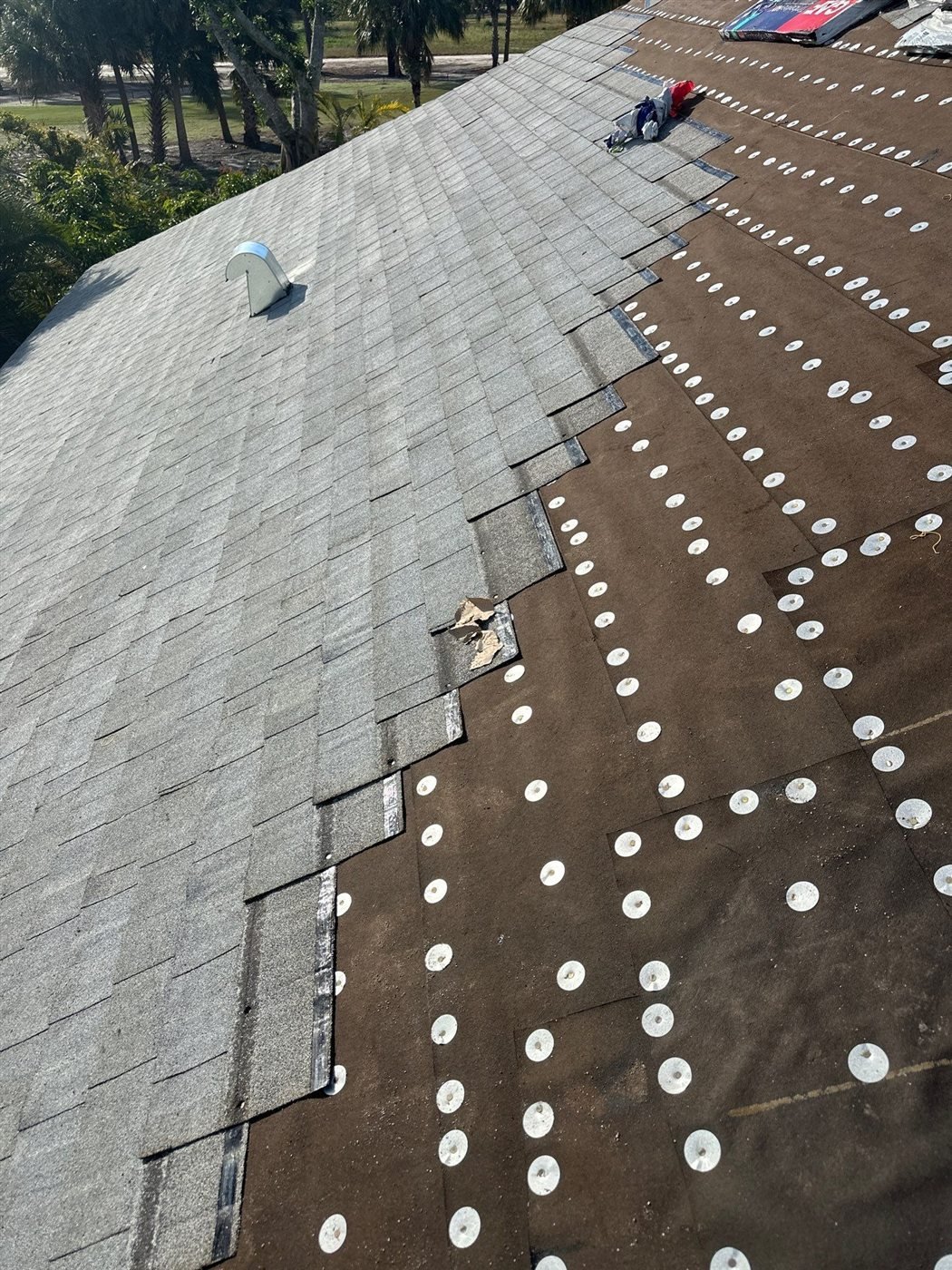 Architectural shingles being installed during a Wellington re-roof